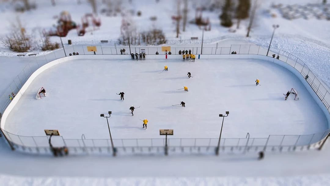 Community outdoor hockey rink in winter